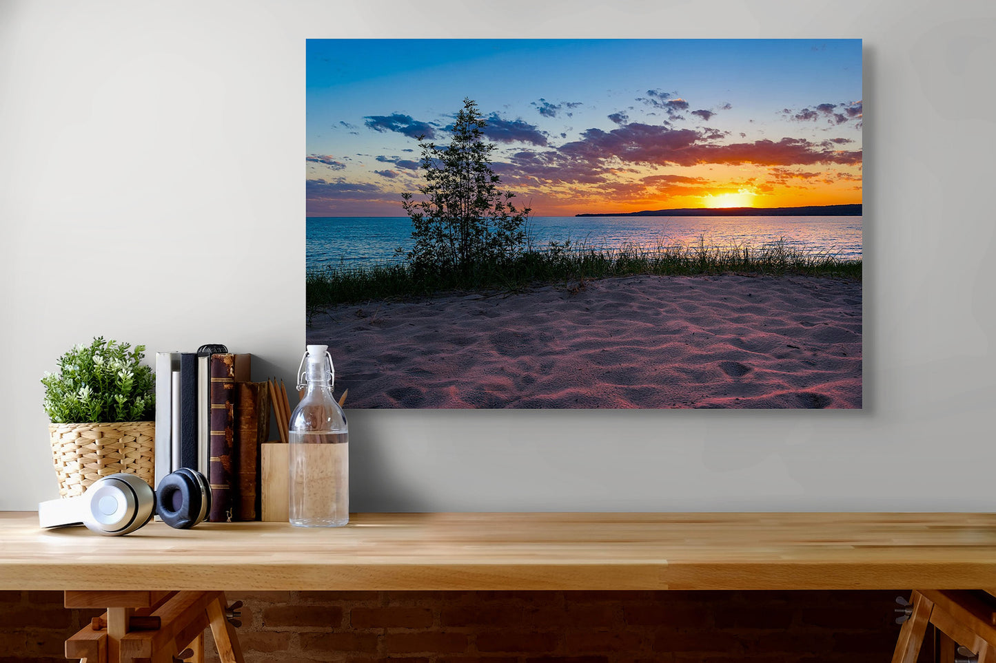 A Petoskey Sunset Michigan fine art print by Dennis Caskey displayed in an office setting