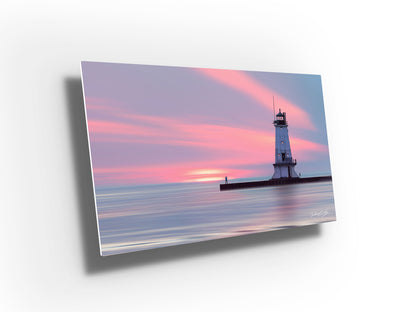 Perspective view of 'Evenings Embrace' fine art print featuring the lighthouse in Ludington Michigan at sunset, available in paper, canvas, metal, and acrylic finishes.									