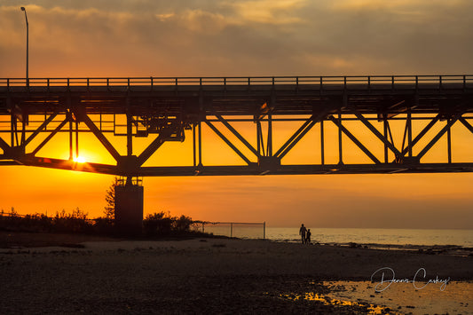 ather and son under Mackinac Bridge, sunset Mackinac Bridge, Michigan bridge photo, family at sunset, Michigan stock photo