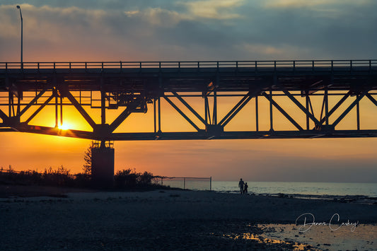 father and son under Mackinac Bridge, sunset Mackinac Bridge, Michigan bridge photo, family at sunset, Michigan stock photo