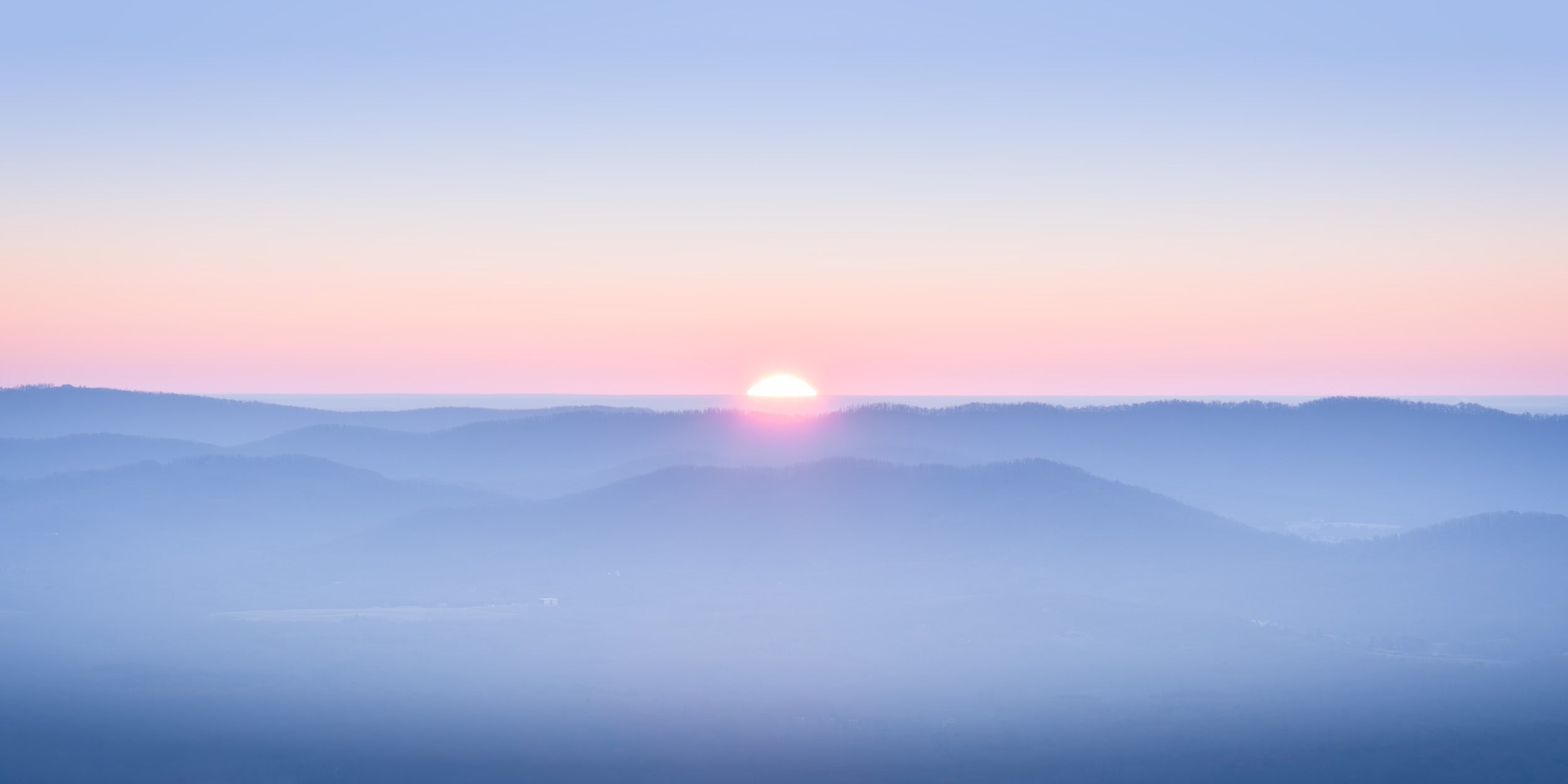 A pastel photograph of the sun rising over the blue ridge mountains - Fine Art Photography by Dennis Caskey